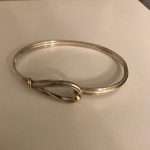 Tiffany & Co. streaking silver bangle bracelet.